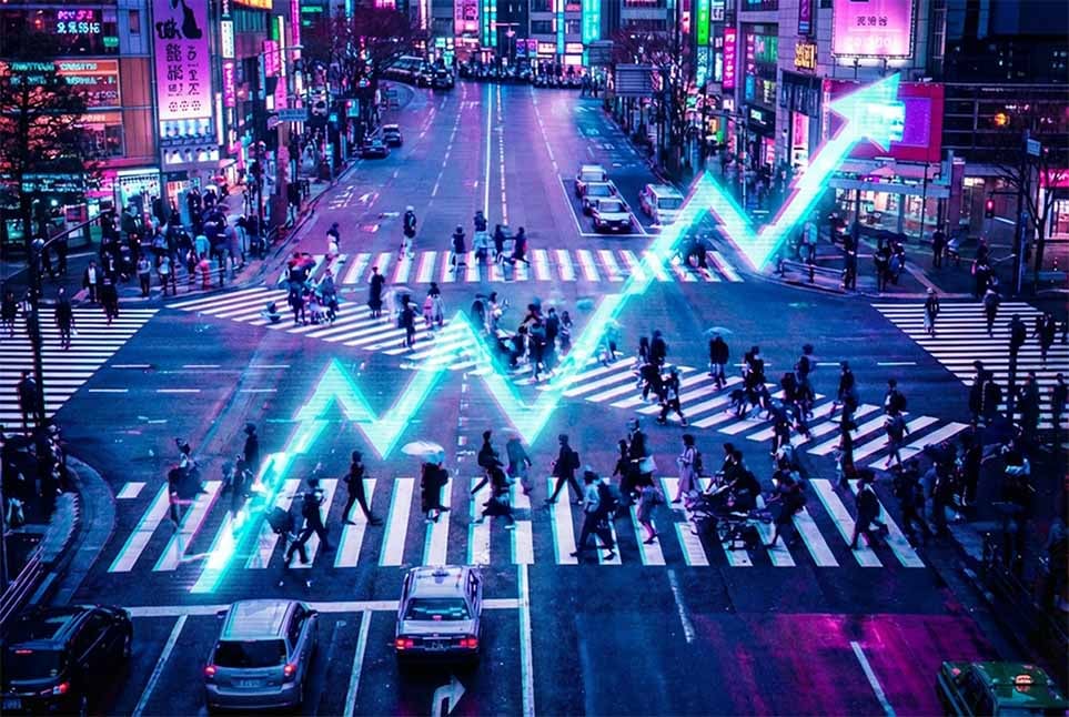 Neon-lit city intersection at night with many pedestrians crossing; a glowing upward graph line overlays the street, symbolizing growth, reach, or increasing performance.